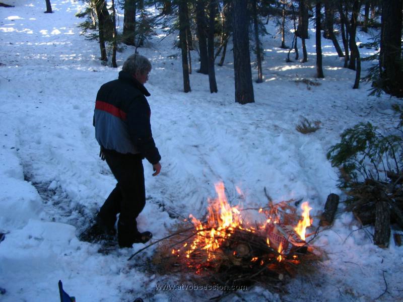 34. Dan gets the fire going..Half bottle of Schnaps later, it would be his Obsession..jpg