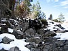 050. Terry shoots Ken giving Dusty a push in the boulder field down to the river..jpg