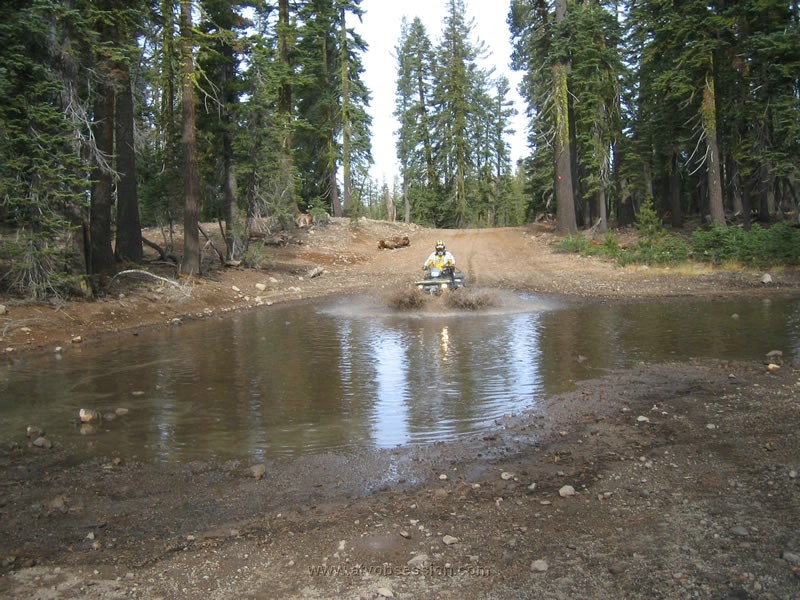 021. Joe hits a big puddle just before Meadow Lake..jpg