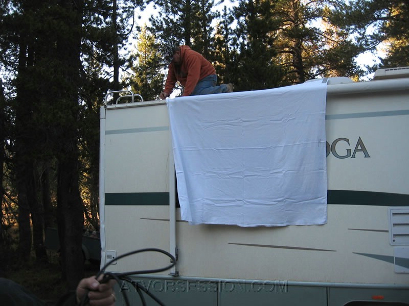 112. Bill hangs the TV sheet..jpg